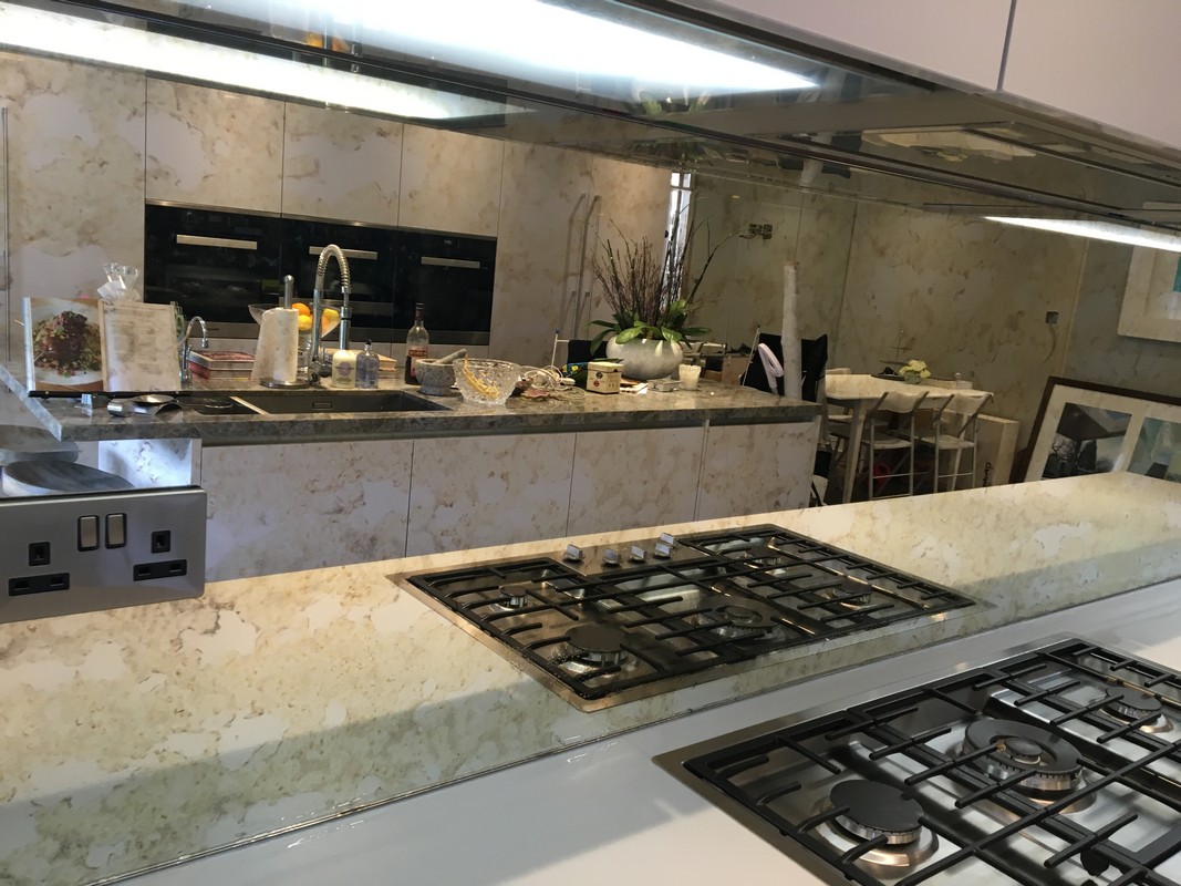 Mirror glass splashback in Poplar luxury kitchen