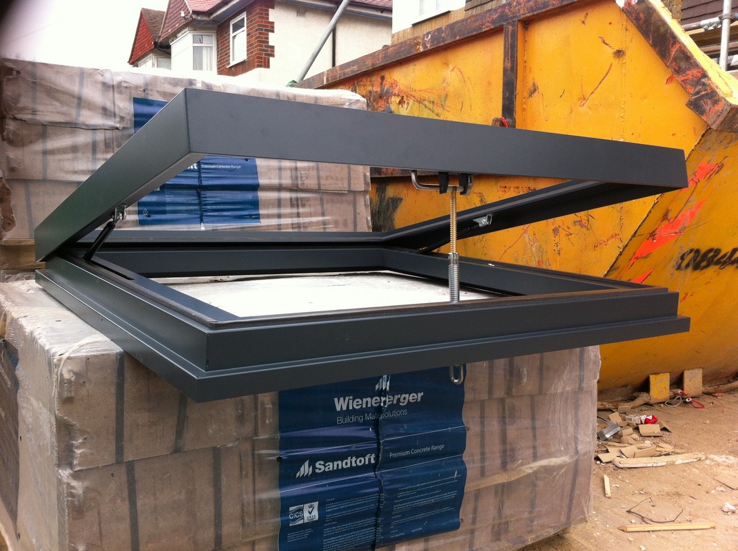 Opening flat roof skylight in anthracite grey installed in Poplar