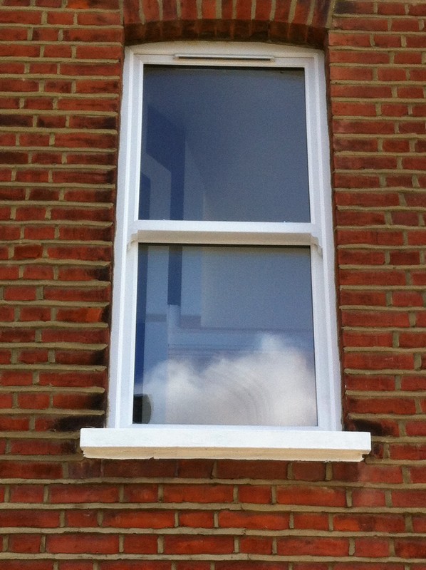 uPVC sash window on Victorian red brick house in Poplar